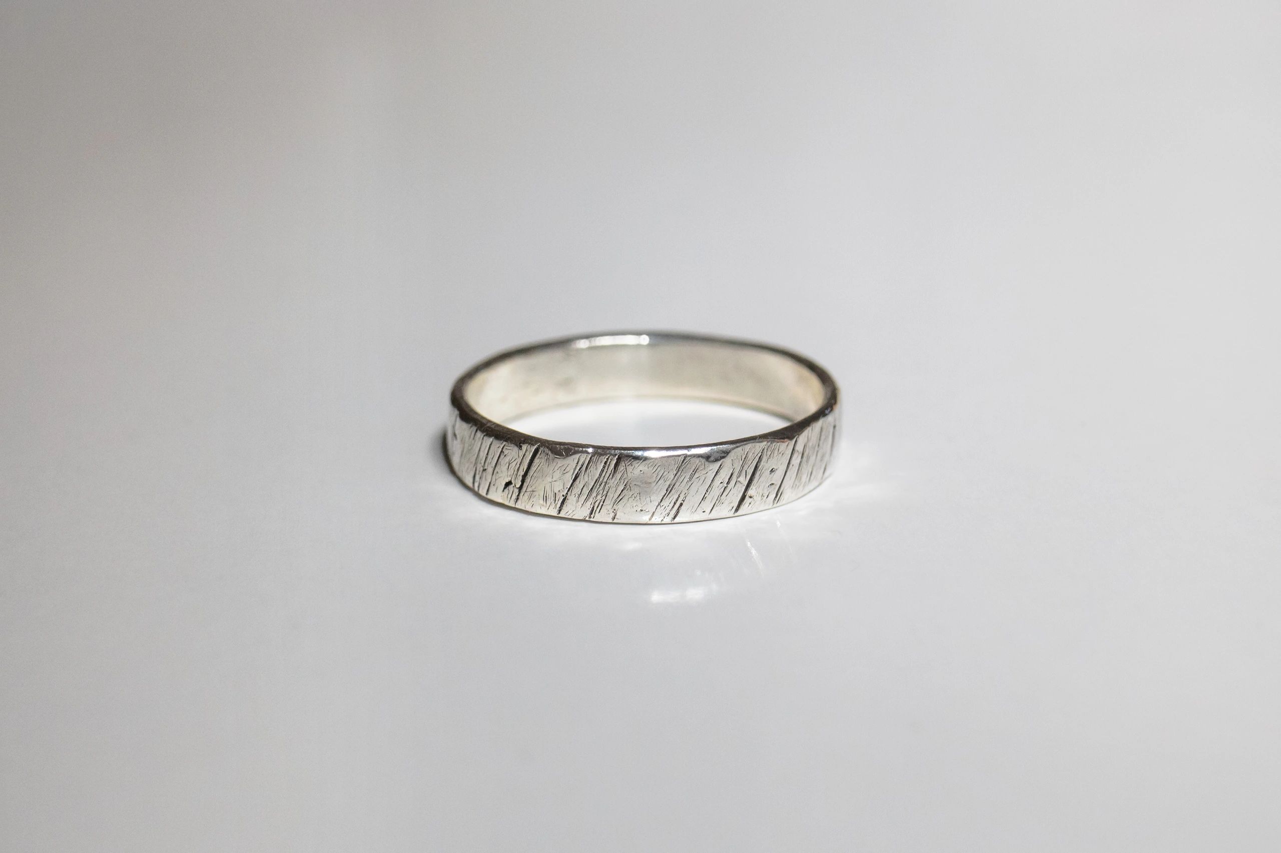 modern silver jewellery on white background