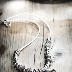 elegant silver necklace, clean modern upscale jewellery product photography